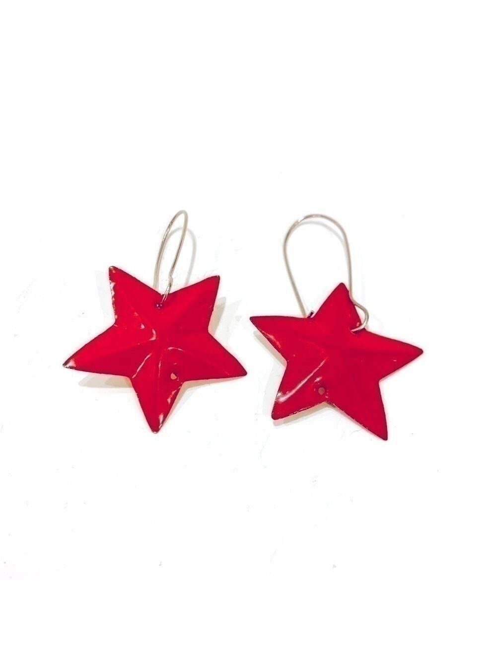 Red star earrings on hooks.